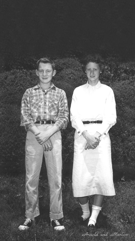 Black and white photo of two students standing side-by-side.