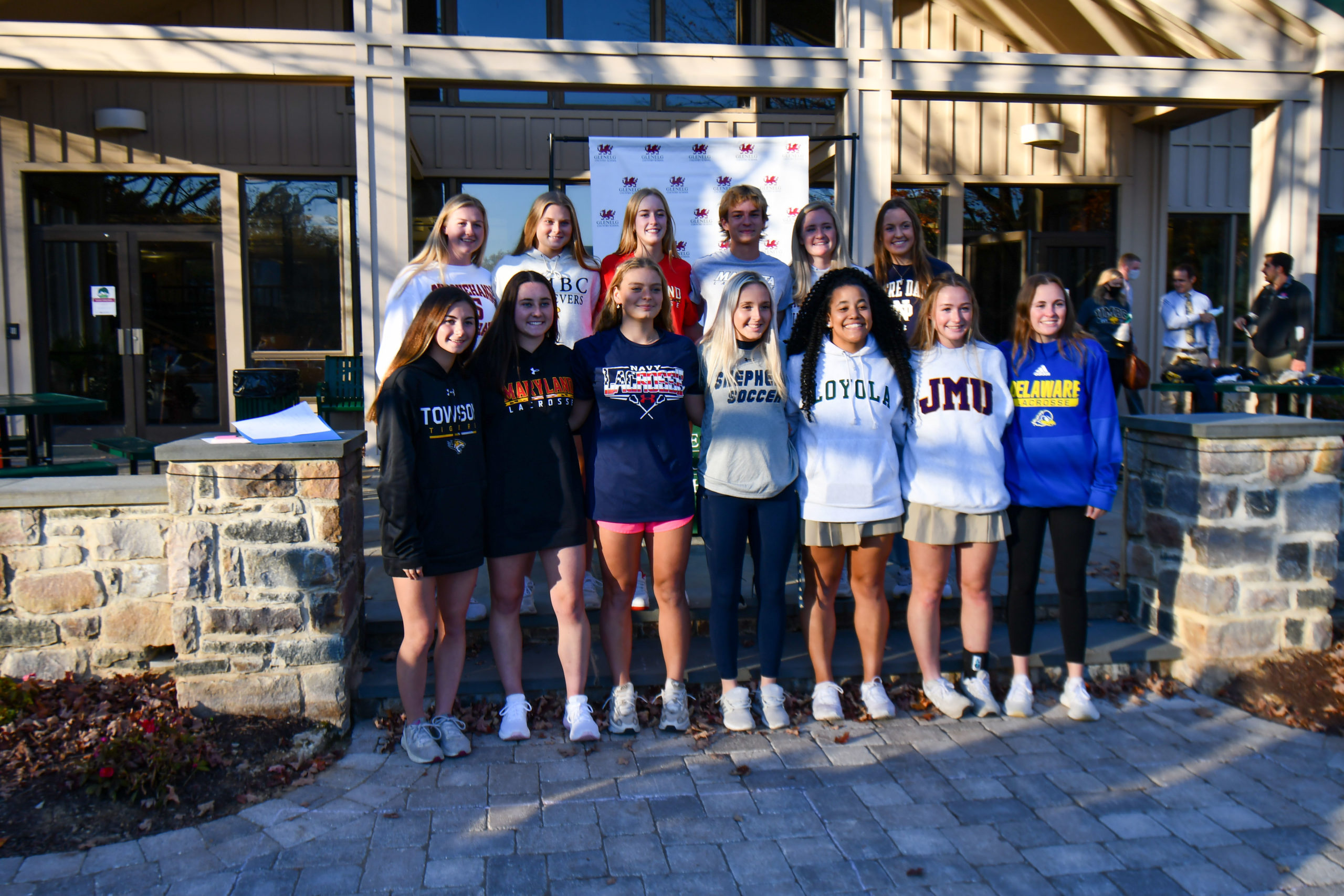 Student-athletes from the Class of 2022 pose for a group photo during the fall Athletics Commitment Celebration.
