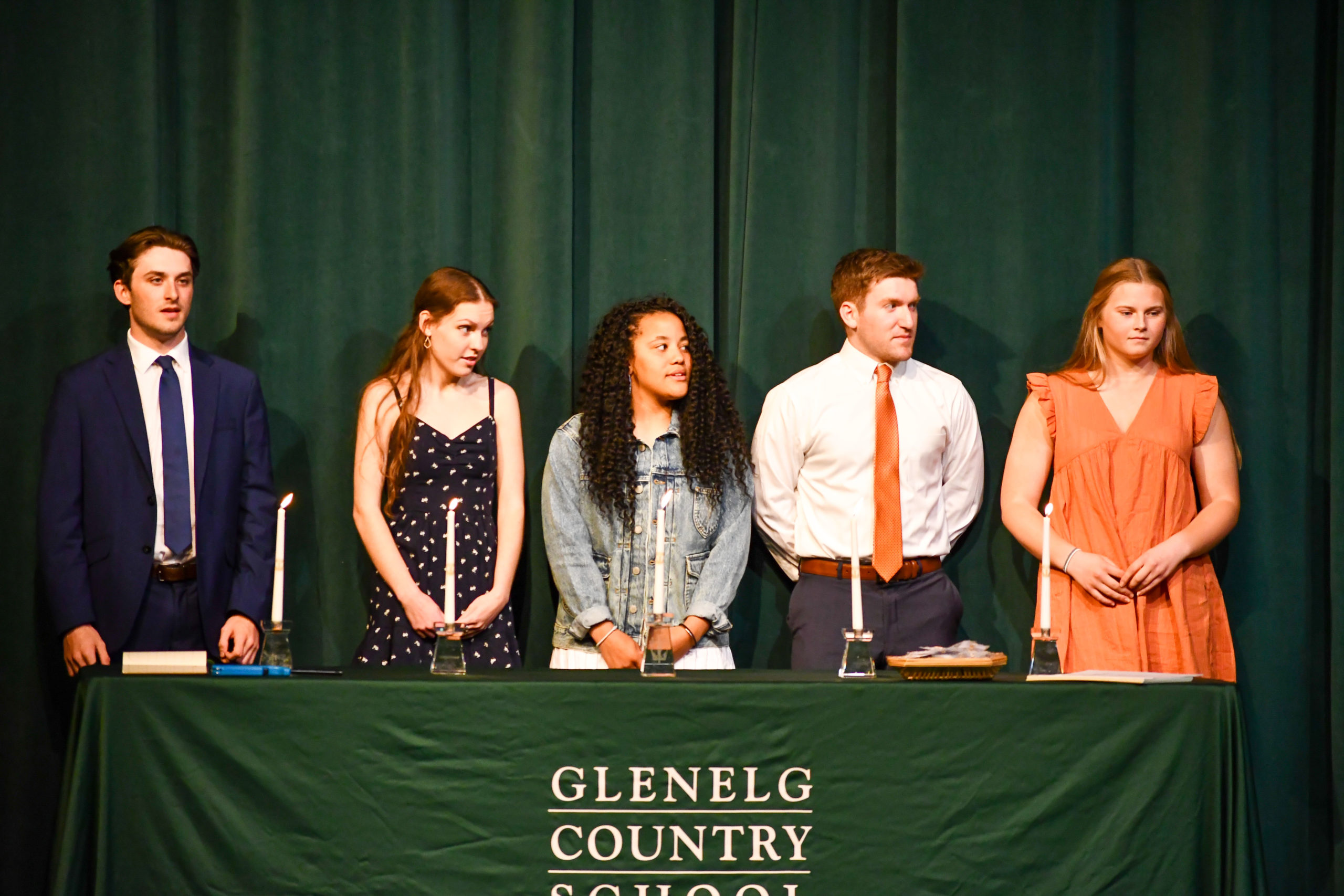 National Honor Society inductees stand on stage during the induction ceremony on April 6, 2022.