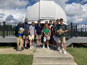 Middle School science students in front of the Gould Observatory.