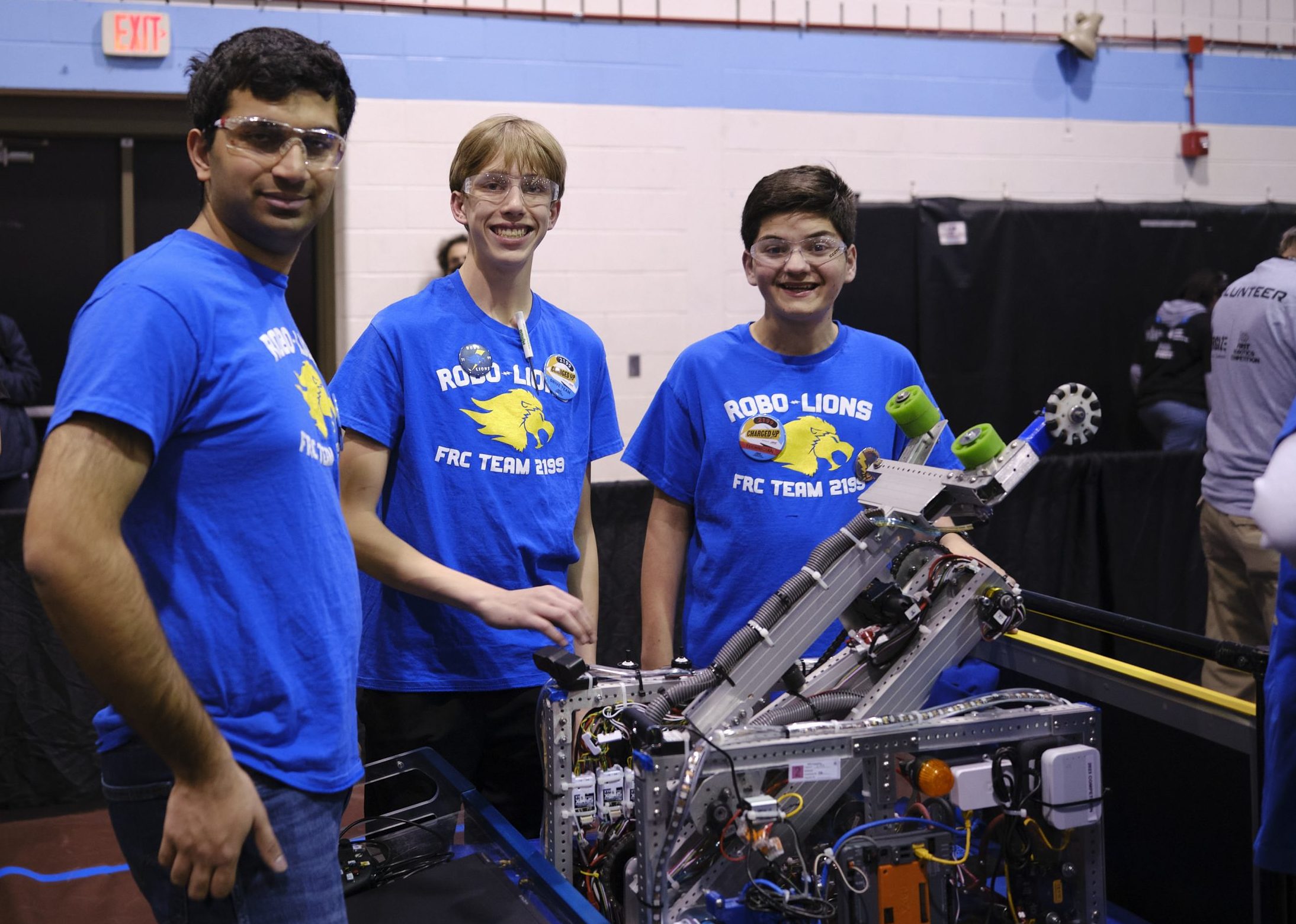 Alex Peirera (left) stands with teammates during a recent robotics competition.