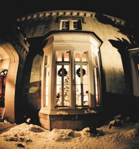 GCS Manor House at night during Christmas, covered in snow