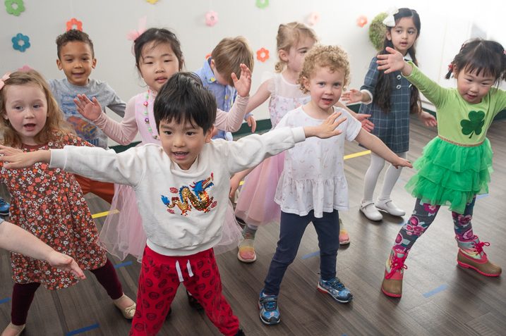 several preschool children performing a song